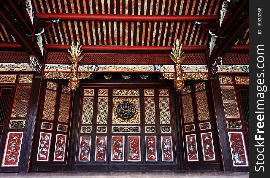 Ancient Chinese Golden Sliding Doors with wooden ceiling, Khoo Kongsi, Pulau Pinang, Malaysia. Ancient Chinese Golden Sliding Doors with wooden ceiling, Khoo Kongsi, Pulau Pinang, Malaysia