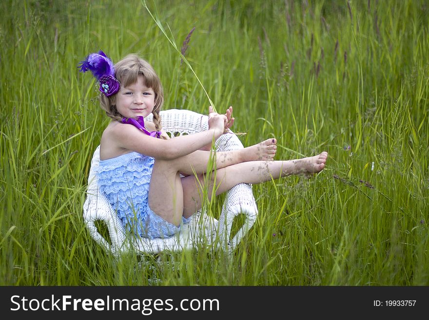 Little girl were a lace petti romper and a feather headband. Little girl were a lace petti romper and a feather headband