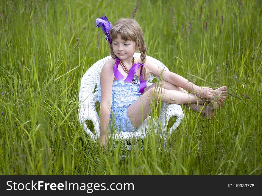 Little girl were a lace petti romper and a feather headband. Little girl were a lace petti romper and a feather headband