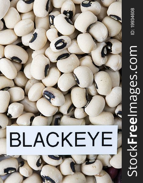 Dried black eyed beans with label close-up macro background