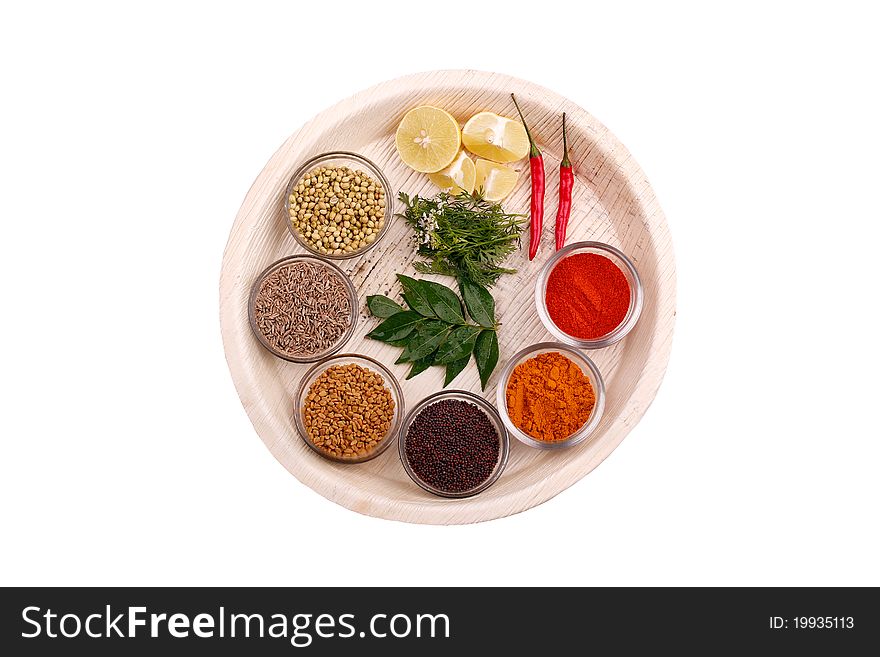 Indian kitchen spices and herbs on a plate. Indian kitchen spices and herbs on a plate