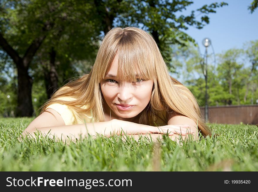 Portrait of the young woman in park. Portrait of the young woman in park