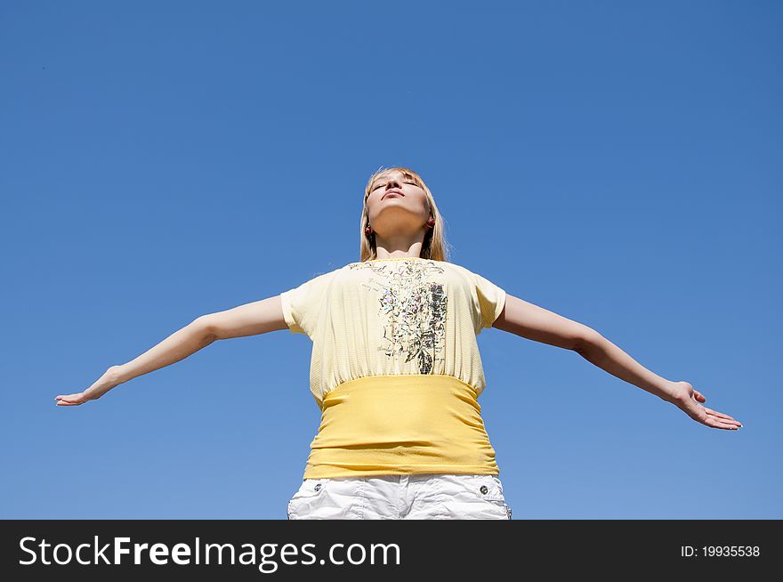 Portrait young woman having stretched hands aspires in the sky