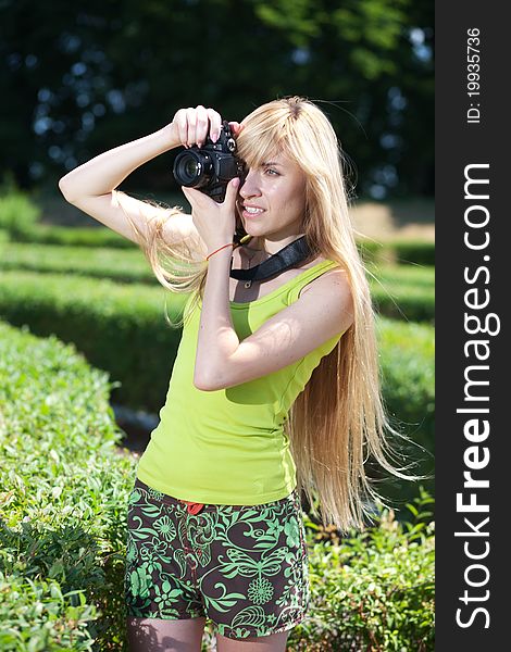 Woman portrait of photographer in park