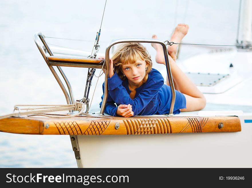 Playful pretty little girl on sail boat. Playful pretty little girl on sail boat