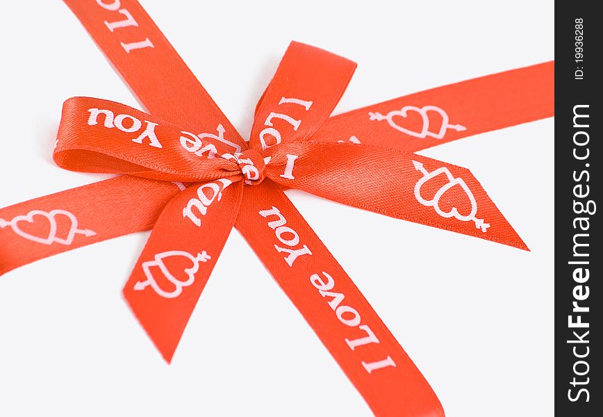 Red gift bow with hearts and symbols. Red gift bow with hearts and symbols.