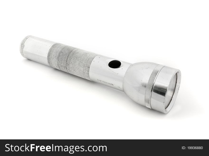 Silver flashlight isolated on white. Silver flashlight isolated on white