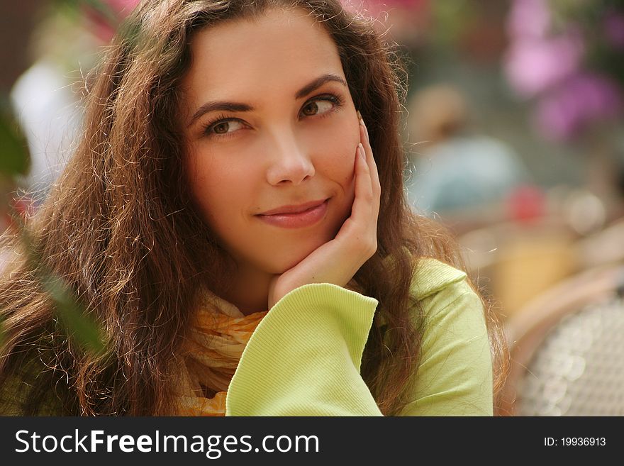 Attractive young woman relaxing outdoors. Attractive young woman relaxing outdoors