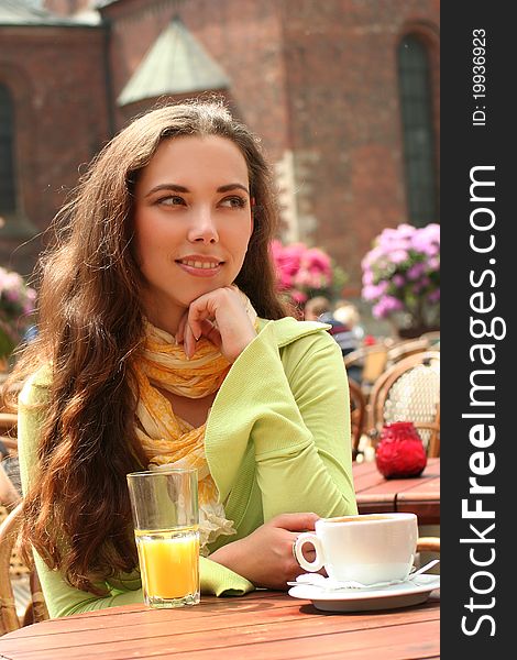 Attractive young woman relaxing in cafe. Attractive young woman relaxing in cafe