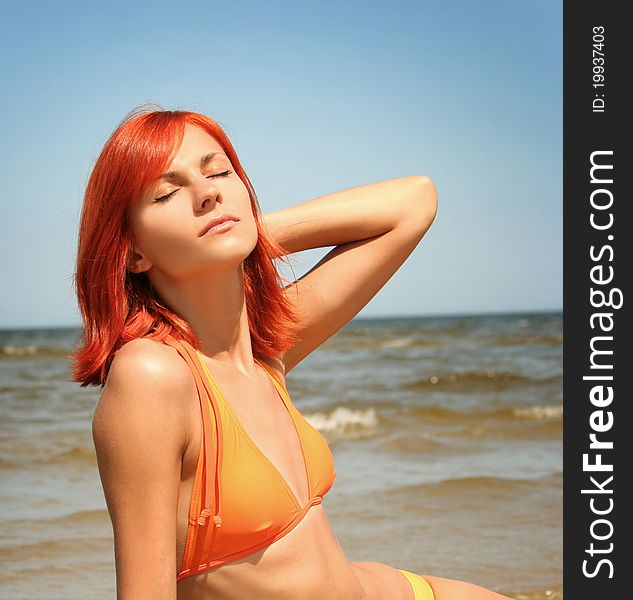 Young woman relaxing on beach. Young woman relaxing on beach