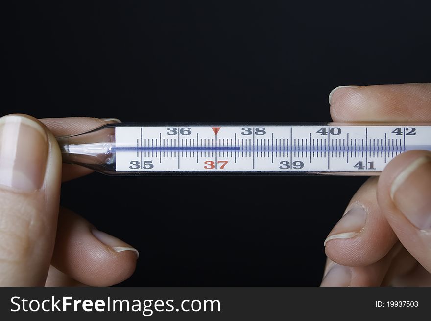 Hands With A Thermometer