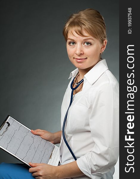 Doctor With Stethoscope And Electrocardiogram