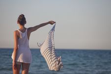 Woman Holding Scarf At The Beach Royalty Free Stock Photos