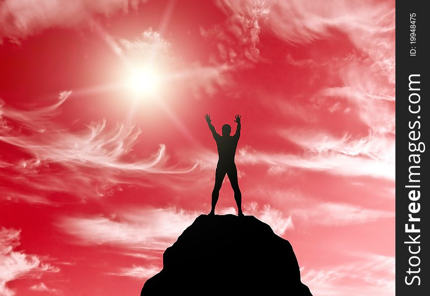 Silhouette of a man at the top of the mountain against the sky