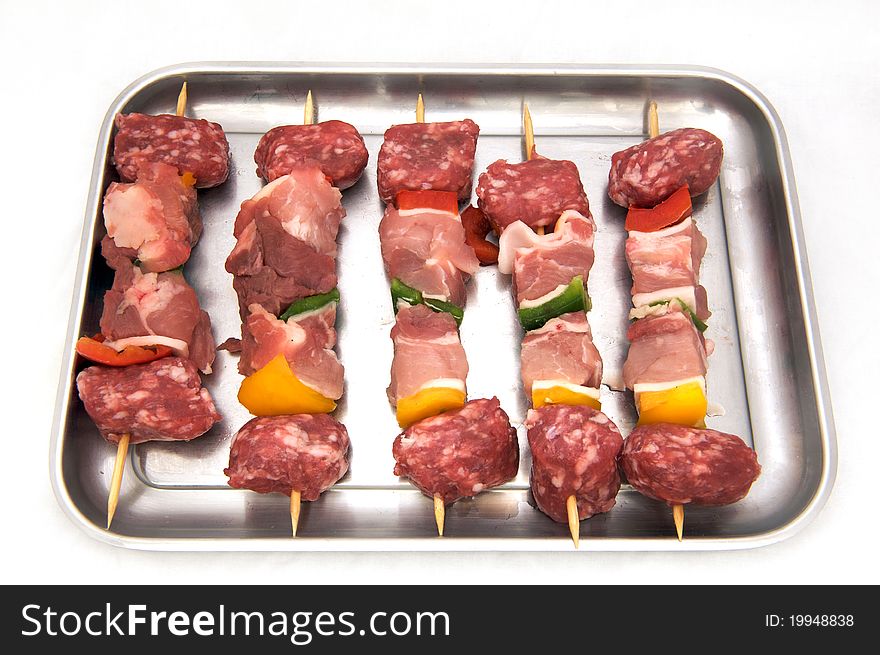 Skewers Of Raw Meat And Peppers, White Background