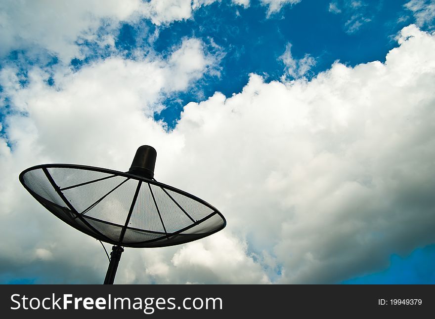 Satellite dish with cloud sky
