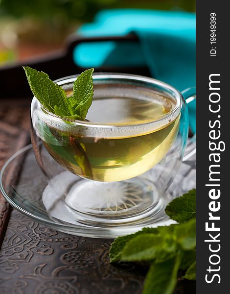 Cup of tea with mint leaves