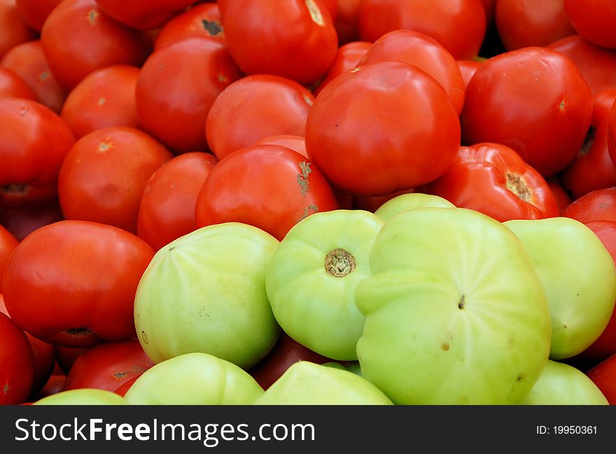 Tomatoes for sale at a local farmers market. Tomatoes for sale at a local farmers market