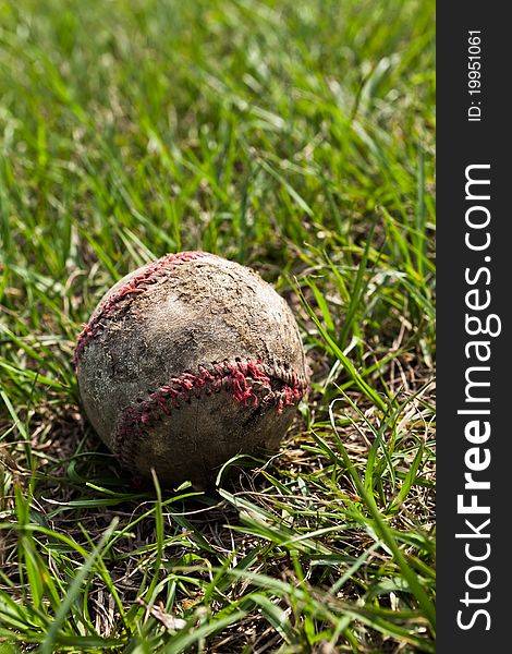 Old Baseball in the grass