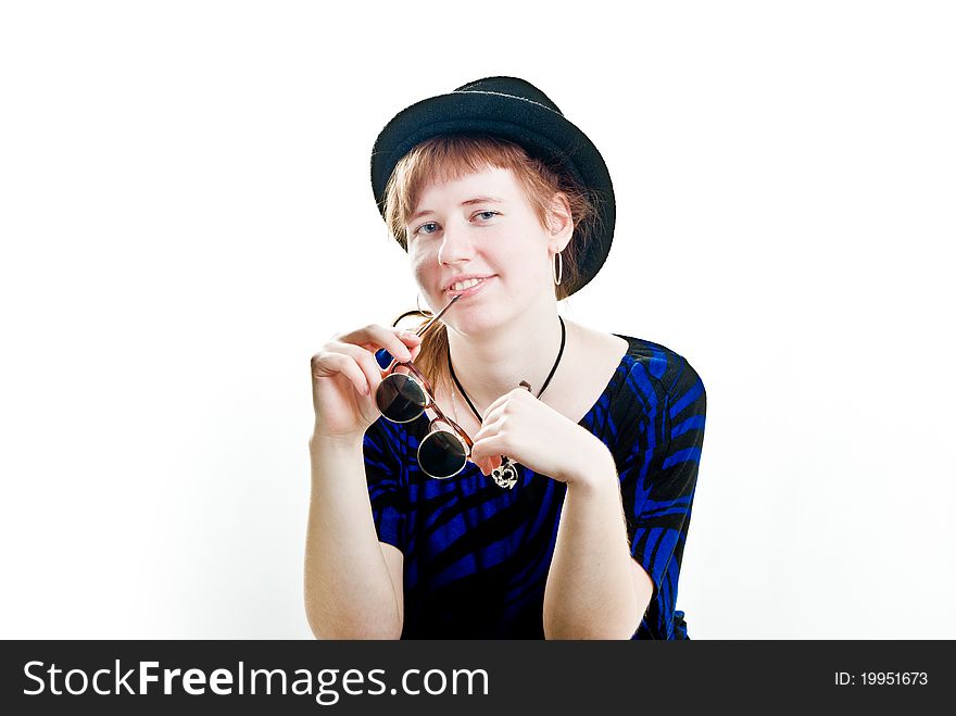 Young woman in black hat with glasses isolated. Young woman in black hat with glasses isolated
