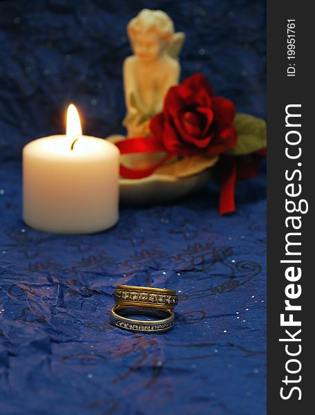 Wedding bands on deep blue background with red accents. Wedding bands on deep blue background with red accents
