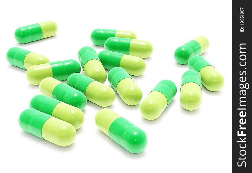 Many green pills on white