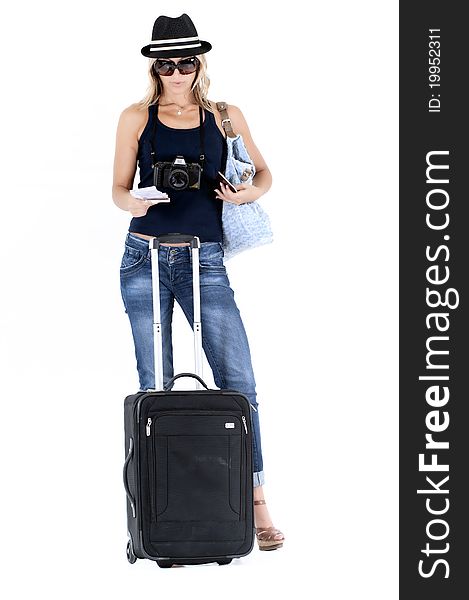 Tourist woman traveling with her passport, luggage, cash and a camera. Tourist woman traveling with her passport, luggage, cash and a camera