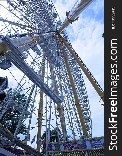 This ferris wheel is over 40 m high. It is one of the attractions at the funfair. This ferris wheel is over 40 m high. It is one of the attractions at the funfair.