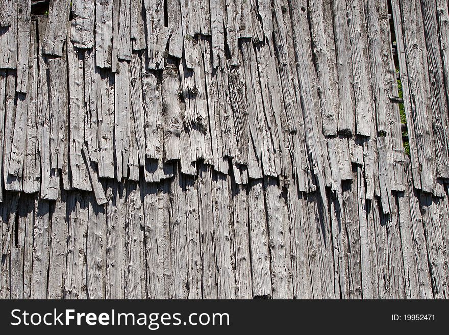 An old and damaged wood roof. An old and damaged wood roof