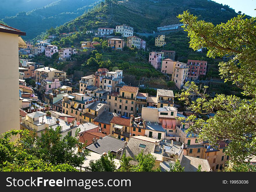 A view looking down to the old village of riomaggiore and the surounding hillside, located in cinque terra, italy. A view looking down to the old village of riomaggiore and the surounding hillside, located in cinque terra, italy.