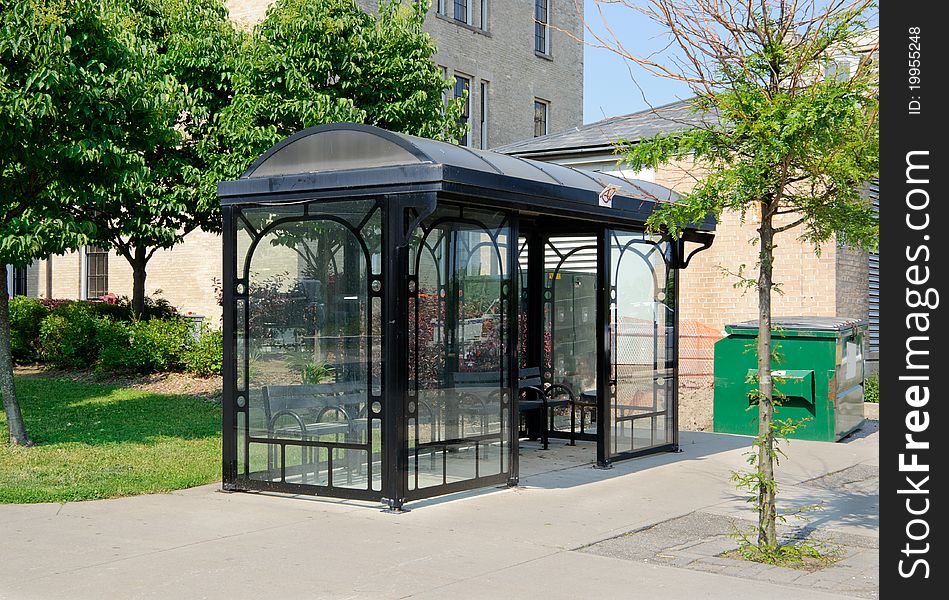 Bus shelter in urban setting. Bus shelter in urban setting