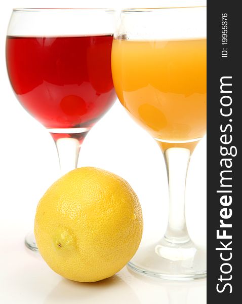 Fresh fruit and juice on a white background