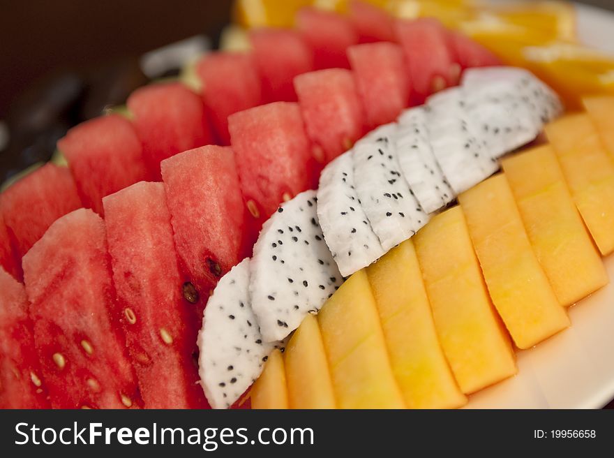 Nicely cut and arranged fruits on a platter tray ready to be served. Nicely cut and arranged fruits on a platter tray ready to be served.