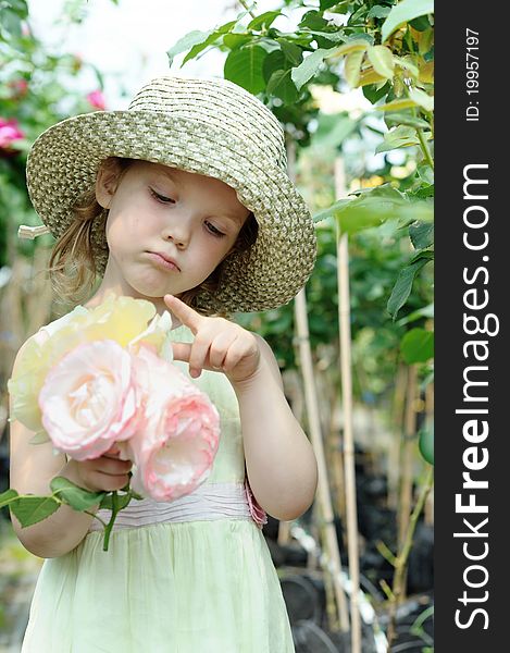 An image of a little girl with big roses