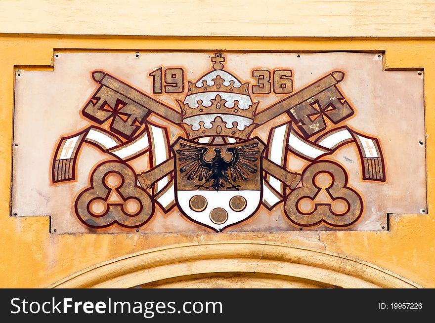 The coat of arms outside the Wambierzyce Basilica in Poland.