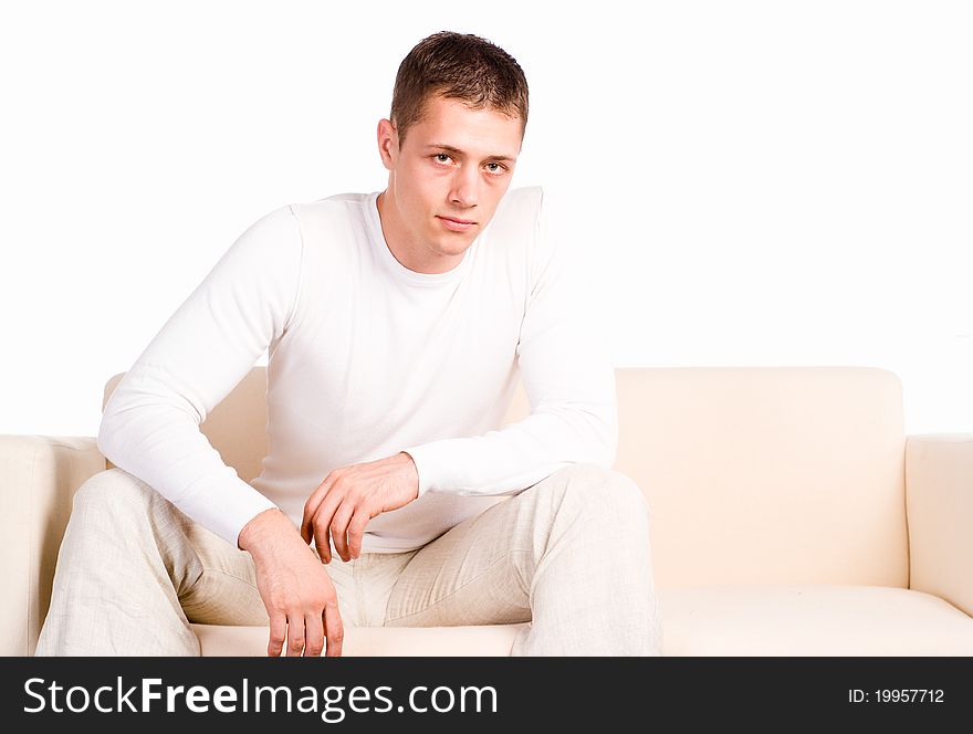 Smart guy in white clothes posing on white background. Smart guy in white clothes posing on white background