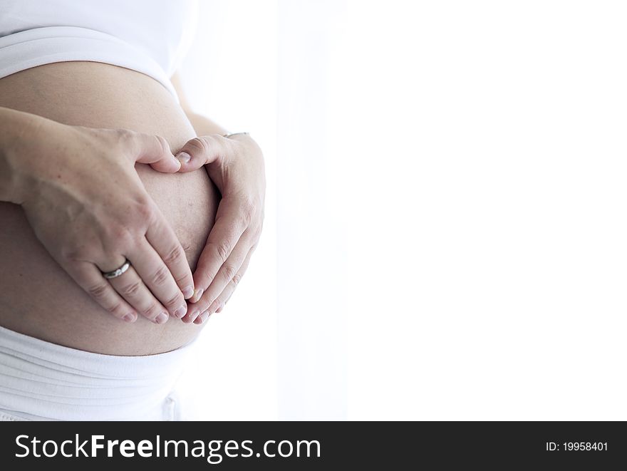 Shot of a pregnant woman and her belly