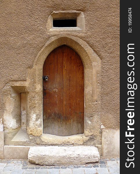 Small old door in an ancient hungarian street.