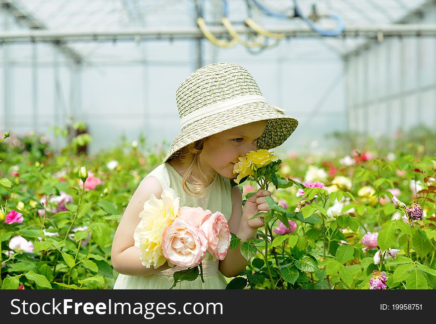 An image of a girl in a greenhouse