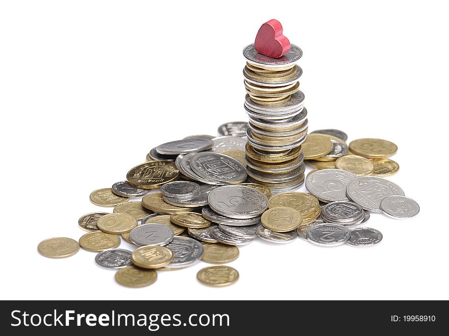 Heap and stack of uah coins isolated on white background