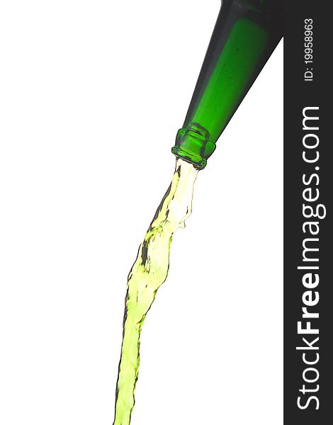 Splashing green water from bottle, isolated over white background. Splashing green water from bottle, isolated over white background.