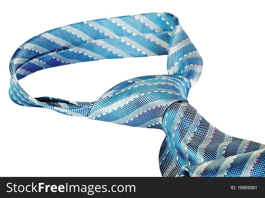 Closeup knot of blue silk necktie isolated over white background