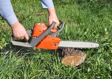 Man S Hands Hold A Petrol Saw Stock Photos Man S Hands Hold A Petrol Saw Stock Photos