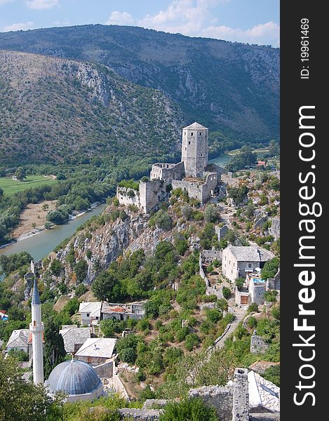 A photograph Pocitelj Town on the Capljina River with mosque nd castle , Bosnia and Herzegovina