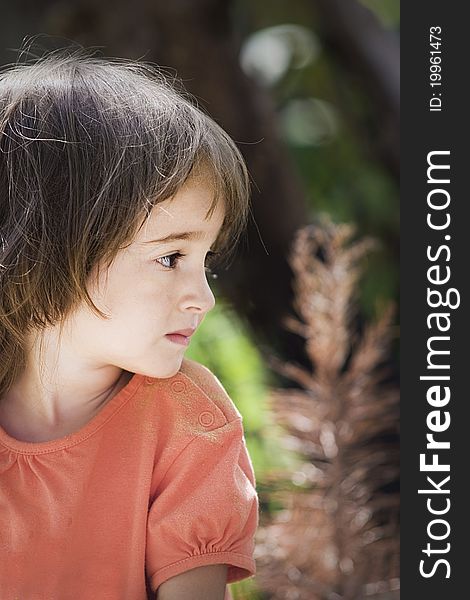 Portrait of a little girl in the garden