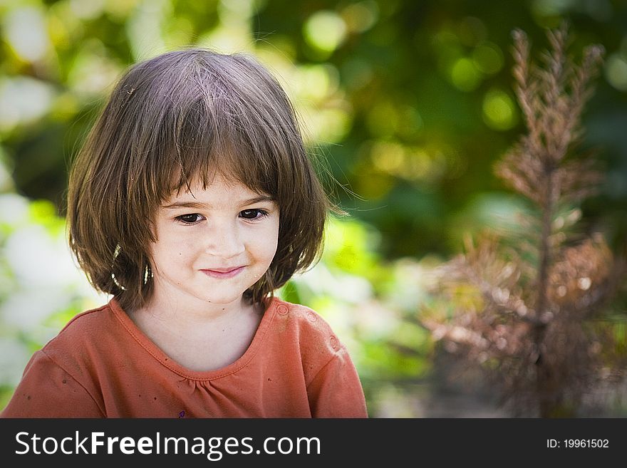 Portrait of a little girl in the garden