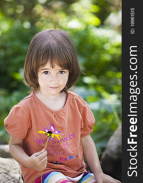 Portrait of a little girl in the garden