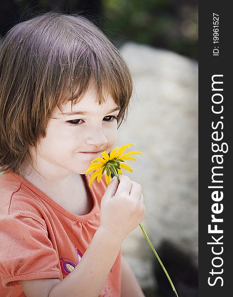 Portrait of a little girl in the garden