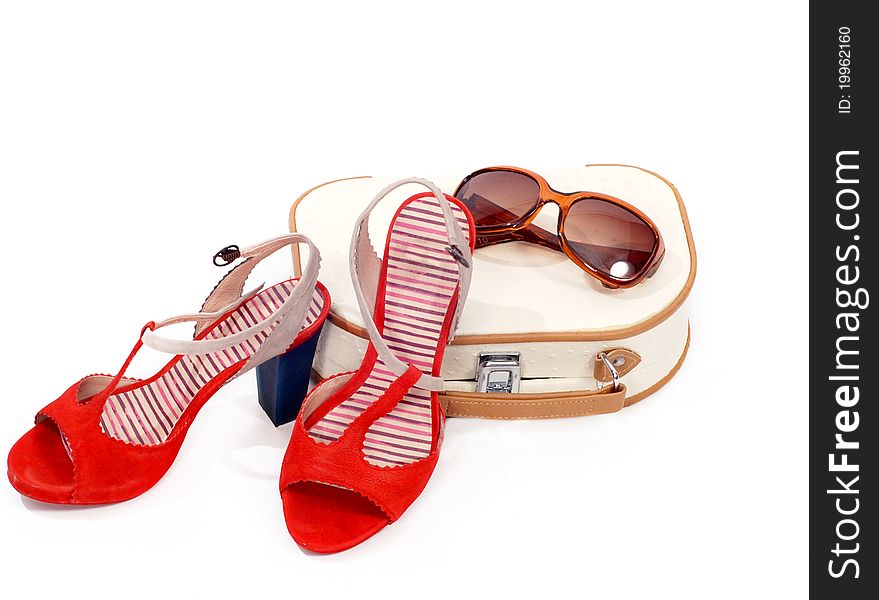 Beautician, shoes and sun glasses over white