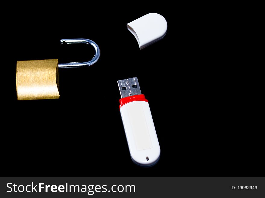 A USB flash disk with an unlock padlock (isolated on black). Concept of an unsecured USB flash disk.